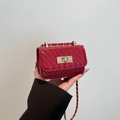 Quilted red patent leather mini crossbody bag with gold chain and turn-lock closure - Red