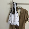 Bolsa de compras blanca con lunares negros y asa con volantes para uso ecológico - Blanco con Lazo