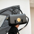 Chic black and gray patchwork crossbody bag with large gold round buckle detail - Black