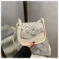 Detail of cream crossbody bag featuring elegant Chinese mountain and cloud embroidery - White