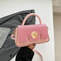 Pink crossbody square bag with textured flap and circular gold metal buckle detail - Pink