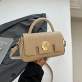 Khaki crossbody bag featuring leather and straw texture with a round gold buckle - Khaki