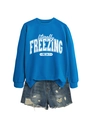 Detail of blue 'literally FREEZING' sweatshirt with snowflake print and denim shorts - S / Tops / Blue (White Print)