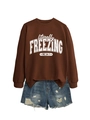 Flat lay of brown literally freezing sweatshirt paired with ripped denim shorts - S / Tops / Coffee