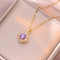 Detailed close-up of golden flower pendant with purple zircon and sparkling crystals - Purple Zirconia Necklace (X1876)