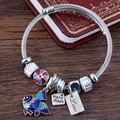 Bracciale a fune metallica con perline di cristallo e ciondolo a pesce smaltato - Blu