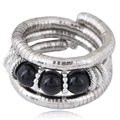 Three-layer silver metal coil bracelet with black onyx beads on white background - Set of 3 / Black