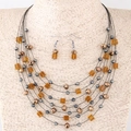 Bohemian multi-layer necklace and earring set with amber beads and bronze accents - Champagne