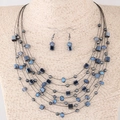 Bohemian multi-layer beaded necklace and earring set with dark crystals on mannequin - Light Blue