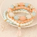 Elegant four-piece layered beaded bracelet set with four-leaf clover charm and tassel fringe - Light Color (110102266)