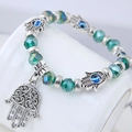 Boho-Kristallperlenarmband mit silberner Hand der Fatima und blauem Auge-Anhänger - Grün