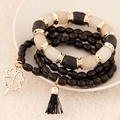 Multi-layer beaded bracelet with black clover charm and silk tassel in gold finish - Black