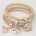 Detailed close-up of three-piece elephant charm bracelets in gold silver and rose gold mesh - Elephant Shape
