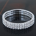 Elegant three-row silver elastic bracelet with clear rhinestones and sparkling finish - 3-Row Style (09052703)