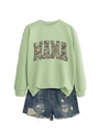 Detail showing ribbed crewneck sweatshirt with camouflage MAMA print and ripped denim shorts - S / Olive Green