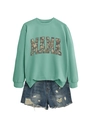 Detail of mint green MAMA sweatshirt with camouflage print and ripped denim shorts set - S / Light Green