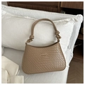 Detail showing the brown woven leather texture and elegant gold bar buckle of the handbag - Khaki