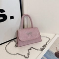 Pink rhinestone mini handbag with silver bow detail and chain strap for crossbody wear - Pink