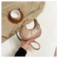 Detail of beige crescent moon bag showing metallic snap and detachable leather strap - Khaki