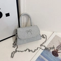 Sparkly silver sequin mini crossbody bag with metal bow accent and thick chain strap - Silver