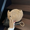 Handwoven straw shoulder bag in light khaki with fringe tassel and wood bead charm - Khaki
