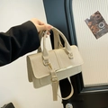 Beige textured top-handle bag with gold hardware and versatile crossbody strap - Khaki