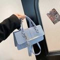 Light blue denim texture crossbody bag with gold metallic bar and adjustable strap - Blue