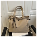 Detail of khaki nylon tote bag featuring adjustable side drawstrings and black snap button - With Charm / Khaki