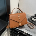 Vintage brown lychee leather crossbody bag with flap and golden buckle accent - Brown