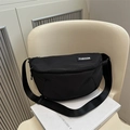 Fashionable black nylon crescent crossbody bag with white logo on adjustable strap - Black