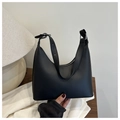 Detail of matte black leather crescent bag with adjustable silver hardware buckle strap - Black