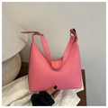 Close-up of bright pink leather Hobo bag with adjustable strap and top zipper closure - Pink