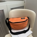 Minimalist orange nylon saddle bag with adjustable strap and fashion label detail - Orange