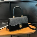 Black woven handbag with silver glitter flap and gold rotary buckle detail - Black