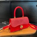 Sparkling red sequin crossbody bag with golden buckle and leather strap - Red