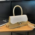Champagne gold tote bag with glitter flap and metal twist lock for elegant commuting - Gold
