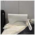 Detail of white envelope bag featuring a unique wavy flap and leather wrist strap - White