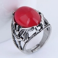 Macro shot of retro silver ring with eagle relief and large red oval gemstone - Red Cabochon Gemstone / Eagle Relief (019022024)
