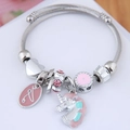 Detail of silver unicorn charm bracelet with pink enamel, love tag and crystal beads - Purple (Love Tag)