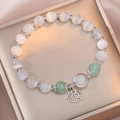 Beaded cat eye stone bracelet with silver lucky charm and green gemstones on jewelry box - Shun Character Bracelet(TS0163)