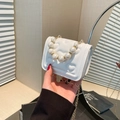 White heart quilted mini crossbody bag with large pearl handle and gold chain strap - White