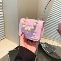 Pink heart-quilted crossbody bag with elegant pearl handle and gold chain strap - Pink