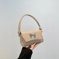 Beige faux leather shoulder bag with silver bow accent and knotted strap detail - Khaki