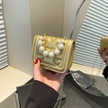 Golden quilted heart mini handbag with pearl handle and chain strap for girls - Gold