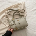 Minimalist bean green pebbled leather tote bag with a dog charm and adjustable strap - With Dog Charm / Elephant Gray