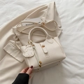Creamy white lychee texture bucket bag with DNA logo and dog charm for women - With Dog Charm / Off White