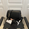 French retro black leather crossbody bag with gold chain strap and curved bottom design - Black