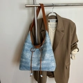 Light blue denim tote bag with brown leather handles and decorative bow detailing - Brown
