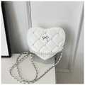 Detail of white heart crossbody bag with quilted lattice, pearls and silver bow accent - White