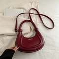 Minimalist burgundy crescent bag in smooth leather with wide handle and shoulder strap - Red